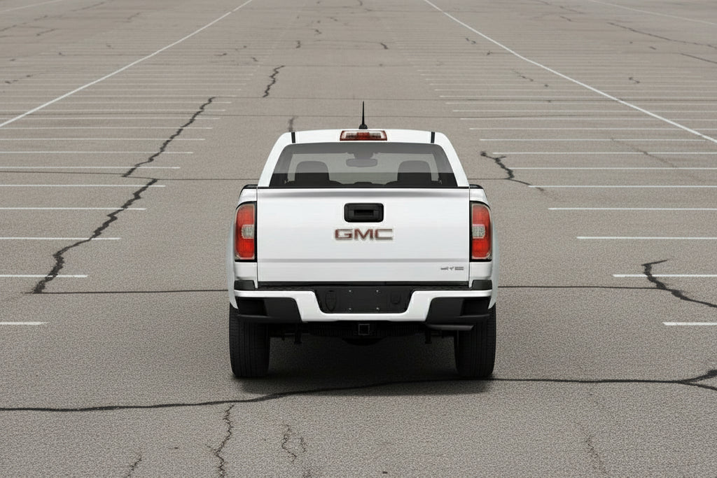 Back view of a white GMC truck on a light gray background